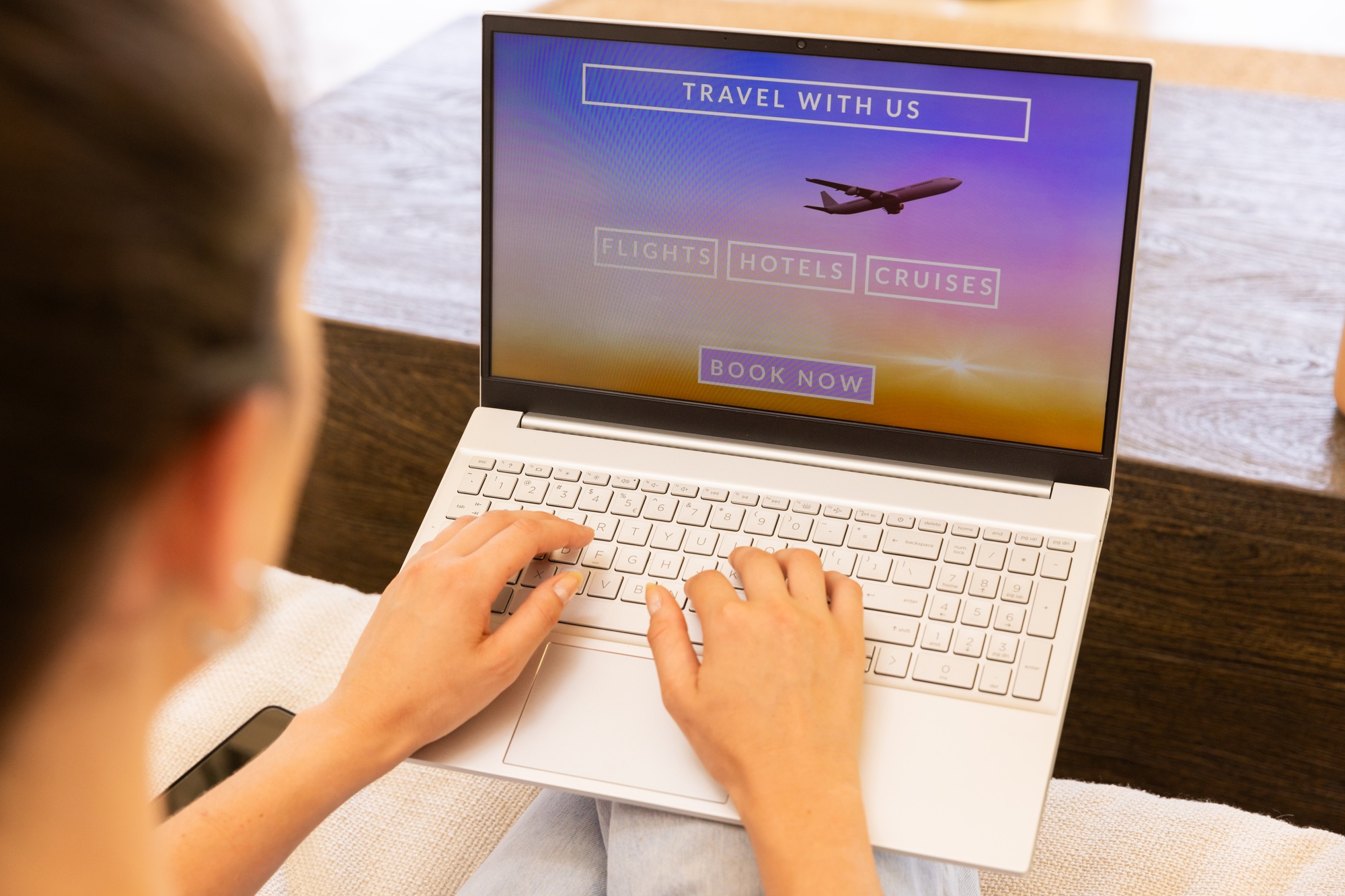 Booking travel online, woman using laptop for flights, hotels, and cruises